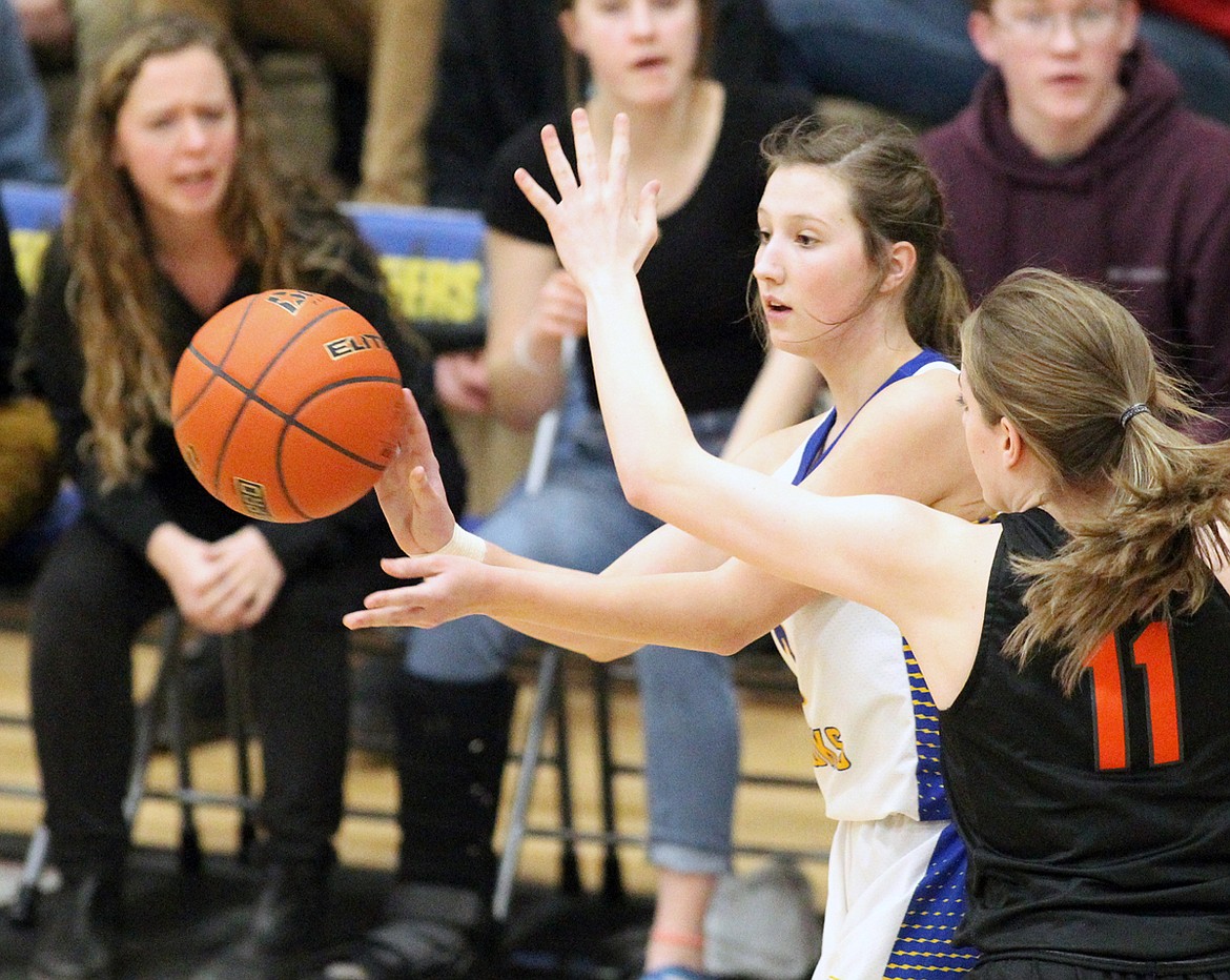 Sophomore Ellie Pardee passes to Faith Frields in second quarter vs. Lady Lions during the 7-B District tournament Saturday at Ralph Tate Gymnasium, Libby. (Paul Sievers/The Western News)