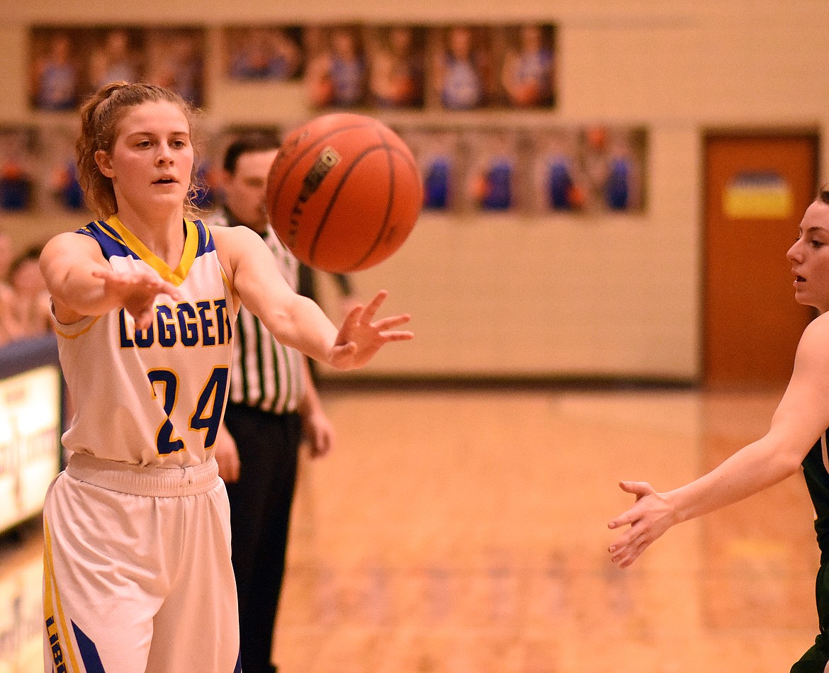 Elise Erickson of the Libby Lady Loggers passes the ball during a Feb. 21 home game against Whitefish. (Duncan Adams/The Western News)