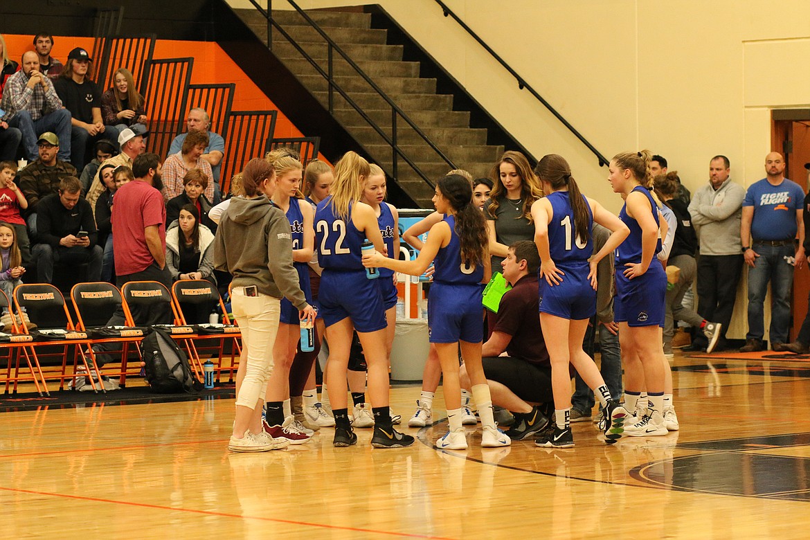 Clark Fork head coach Jeff Schultz talks to his team during a timeout in Friday's game. (Chuck Bandel/Mineral Independent)