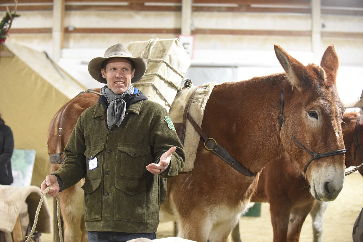 Guy Zoellner, the Trails Manager for the Spotted Bear Ranger District, shares a laugh with his audience at last Saturday&#146;s Back Country Horsemen of the Flathead&#146;s clinic on safety and horse and mule packing. (Scott Shindledecker/Daily Inter Lake)