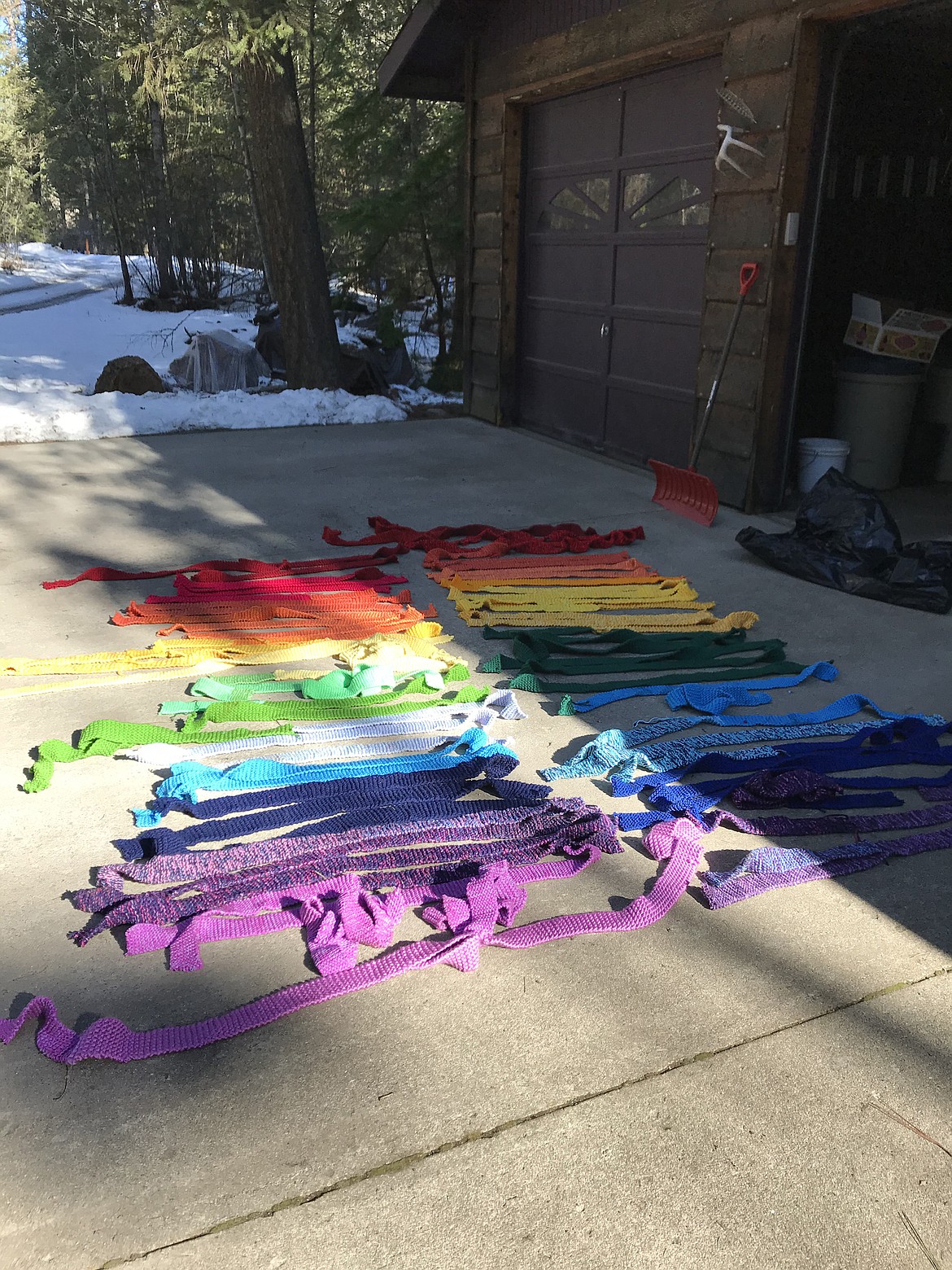 (Photo courtesy VICKI REICH)
Strands of the yarn bomb ribbons lay in Vicki Reich&#146;s driveway as they undergo assessment for damage.