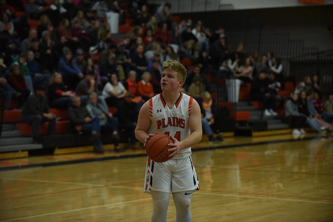 Plains&#146; Jake Weyers (44) sizes up a free throw during Friday&#146;s game in the 14-C District tournament. Weyers&#146; 3-point shooting helped the Horsemen to a 70-46 win over Hot Springs. Plains beat St. Regis Saturday for the title. (Scott Shindledecker/Valley Press)