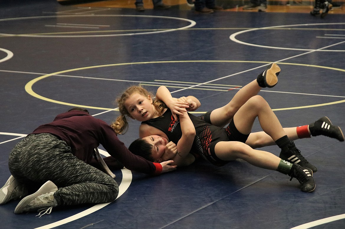 (Photo courtesy of TAMI WOOD)
Vanessa Hood gets ready to pin her opponent en route to a third place finish in Deer Park on Feb. 2.