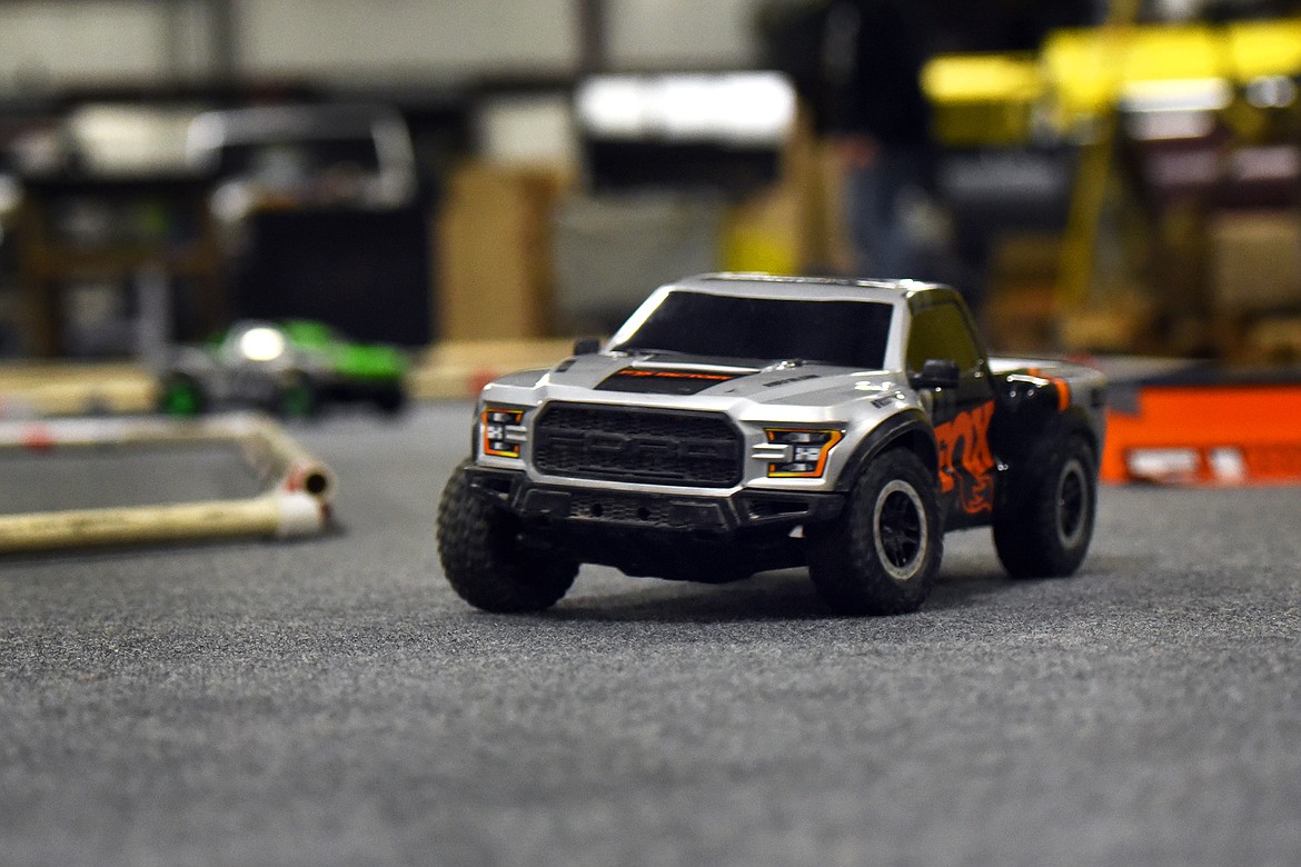 AN RC racer vecicle travels the 
course during practice at Glacier 
Steel Roofing Products.