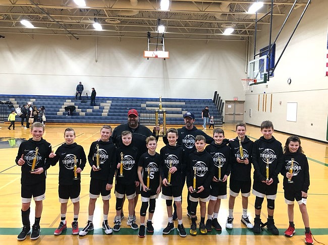 Courtesy photo
The River City sixth-grade boys AAU basketball team won the seventh-grade division in the Lake City Shootout on Feb. 14-16. They went 3-1 in pool play, dropping a game to the Moscow Gun Show. They came back and beat the Moscow Gun Show in the championship 48-47. In the front row from left are Jaxon Bowman, Jake Hill, Andy Evenson, Jace Taylor, Payton Winey, Wren Jackson, Seth Stevens, Will Jackson, Beau Pearson, Peyton Hillman and Seth Brooks; and back row from left, coaches Chris Pearson and Sean Taylor.