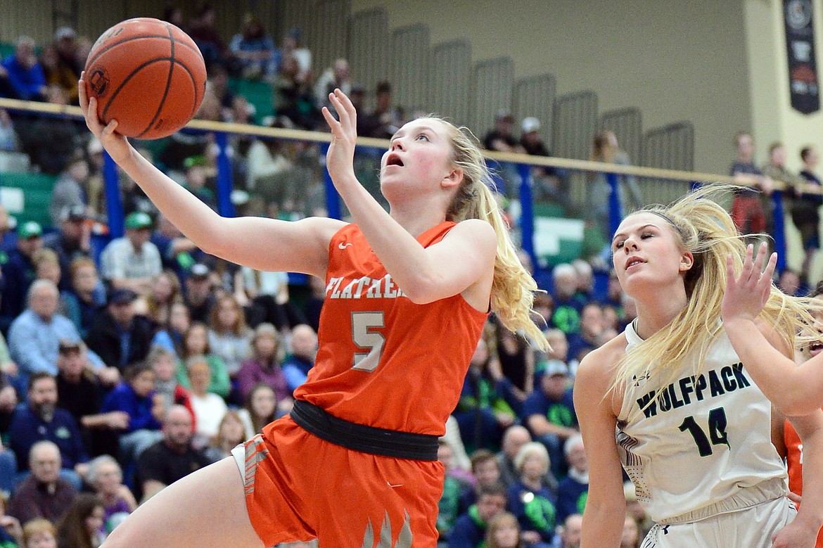 Flathead's Maddy Moy (5) drives to the hoop against Glacier during a crosstown matchup at Glacier High School on Friday. (Casey Kreider/Daily Inter Lake)