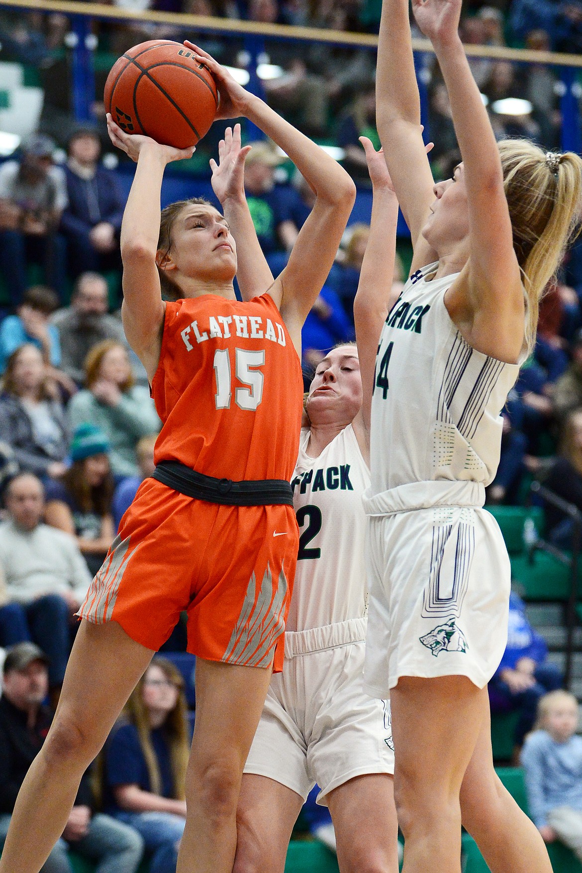 Flathead's Clare Converse (15) looks to shoot against Glacier's Kenzie Williams (12) and Aubrie Rademacher (14) during a crosstown matchup at Glacier High School on Friday. (Casey Kreider/Daily Inter Lake)