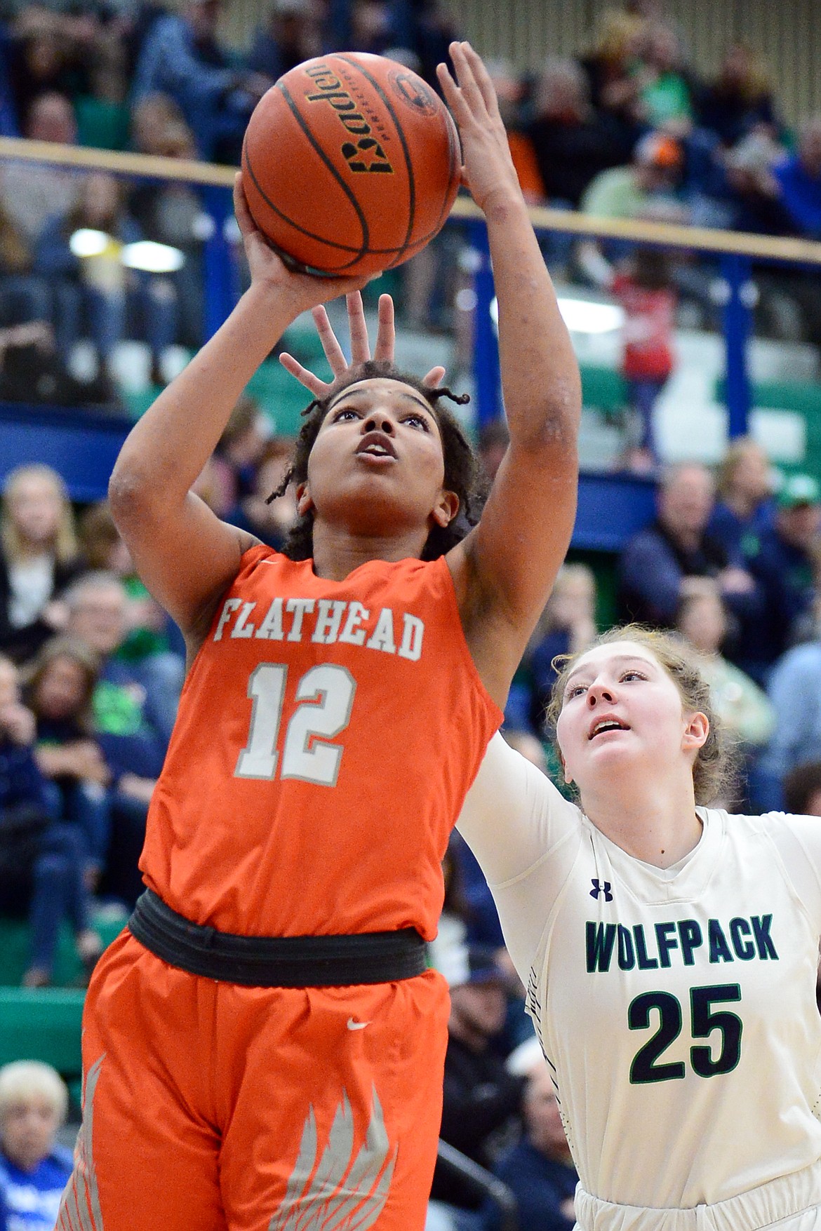 Flathead's Akilah Kubi (12) drives to the hoop against Glacier's Emma Anderson (25) during a crosstown matchup at Glacier High School on Friday. (Casey Kreider/Daily Inter Lake)