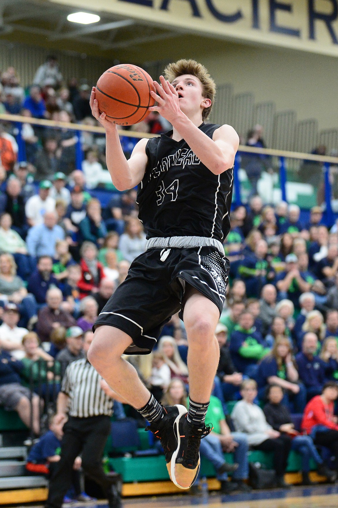 Flathead's Joston Cripe (34) goes to the hoop against Glacier during a crosstown matchup at Glacier High School on Friday. (Casey Kreider/Daily Inter Lake)