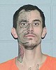 Two men arrested in standoff, but alleged shooter still at large