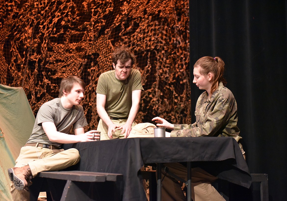 Nathan Sproul, Dashiell Schindler and Eden Scrafford&#160;discuss the state of the Army hospital unit during a rehearsal for &#147;MASH&#148; at the Whitefish Performing Arts Center. The Whitefish High School Drama Club brings the play to the stage on March 5, 6 and 7. (Heidi Desch/Whitefish Pilot)