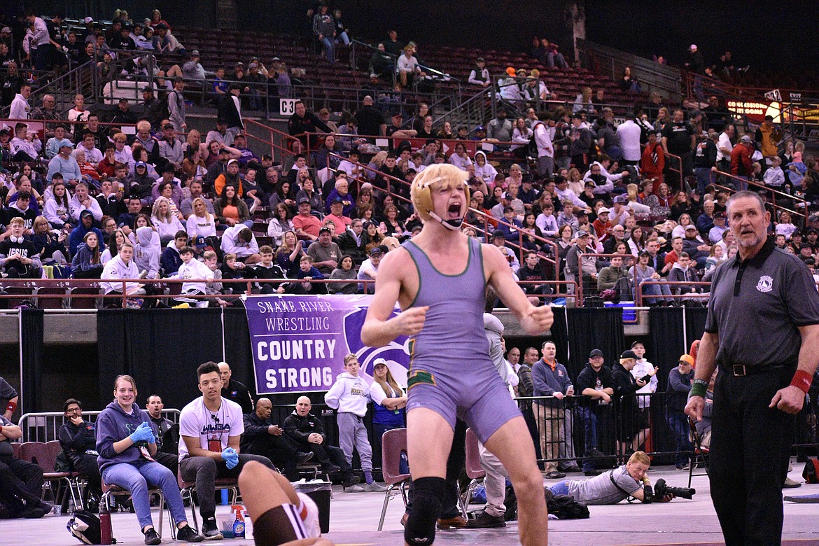 MOLLY MASON/Special to Hagadone News Network
Colton Boettcher of Lakeland celebrates after pinning Zuriel Angulo of Vallivue in the state 4A 170-pound championship match Saturday at the Ford Idaho Center in Nampa.