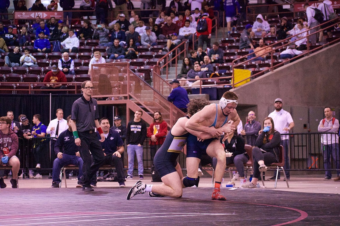 MOLLY MASON/Special to Hagadone News Network
Matthew Whitcomb of Lake City looks to escape from Reuben Thill of Lewiston in the state 5A 182-pound championship match Saturday at the Ford Idaho Center in Nampa. Whitcomb won 12-5.