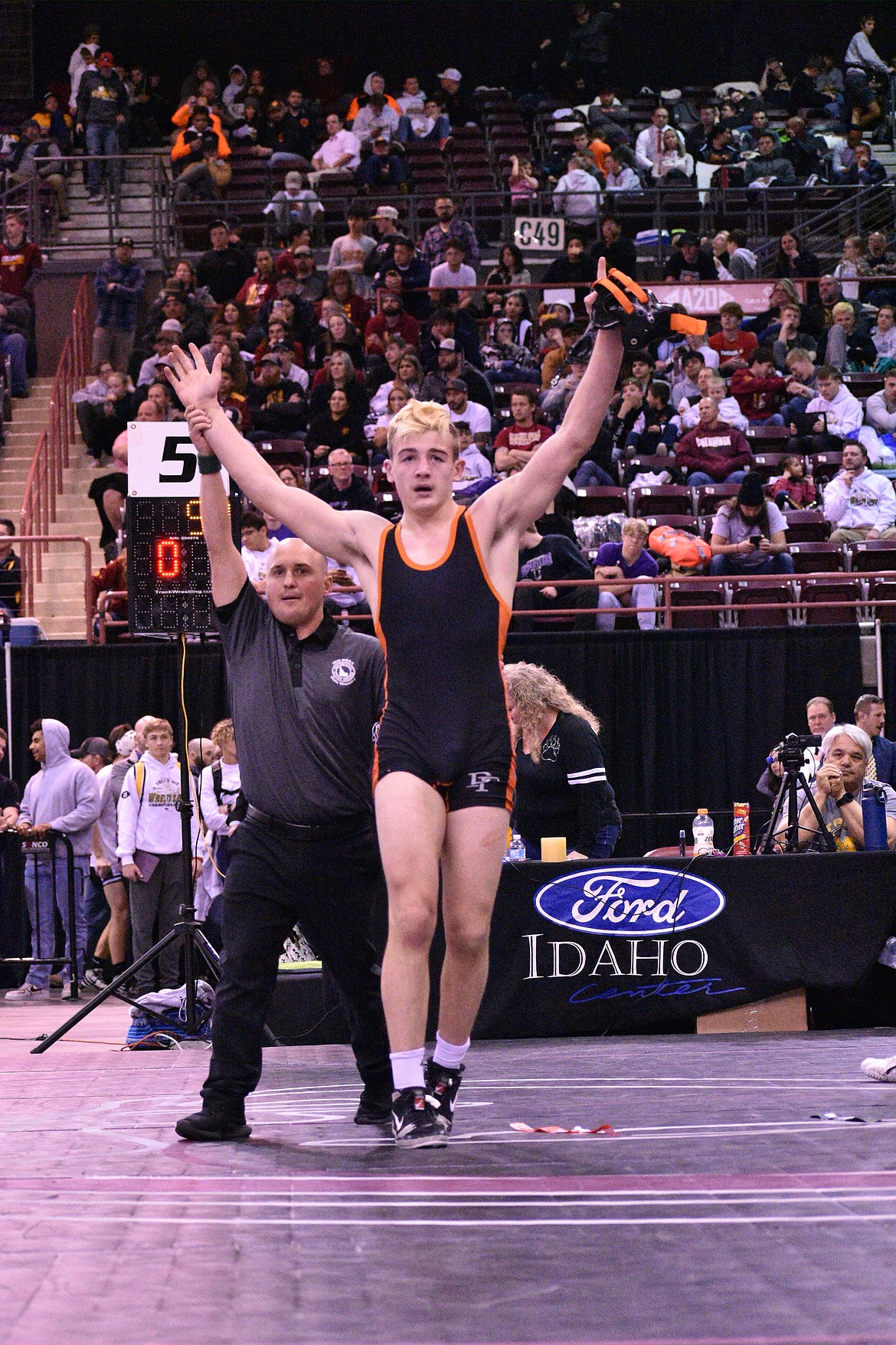 MOLLY MASON/Special to Hagadone News Network
Ethan Miller of Post Falls celebrates after beating Jett Nelson of Centennial by major decision in the state 5A 152-pound championship Saturday at the Ford Idaho Center in Nampa.