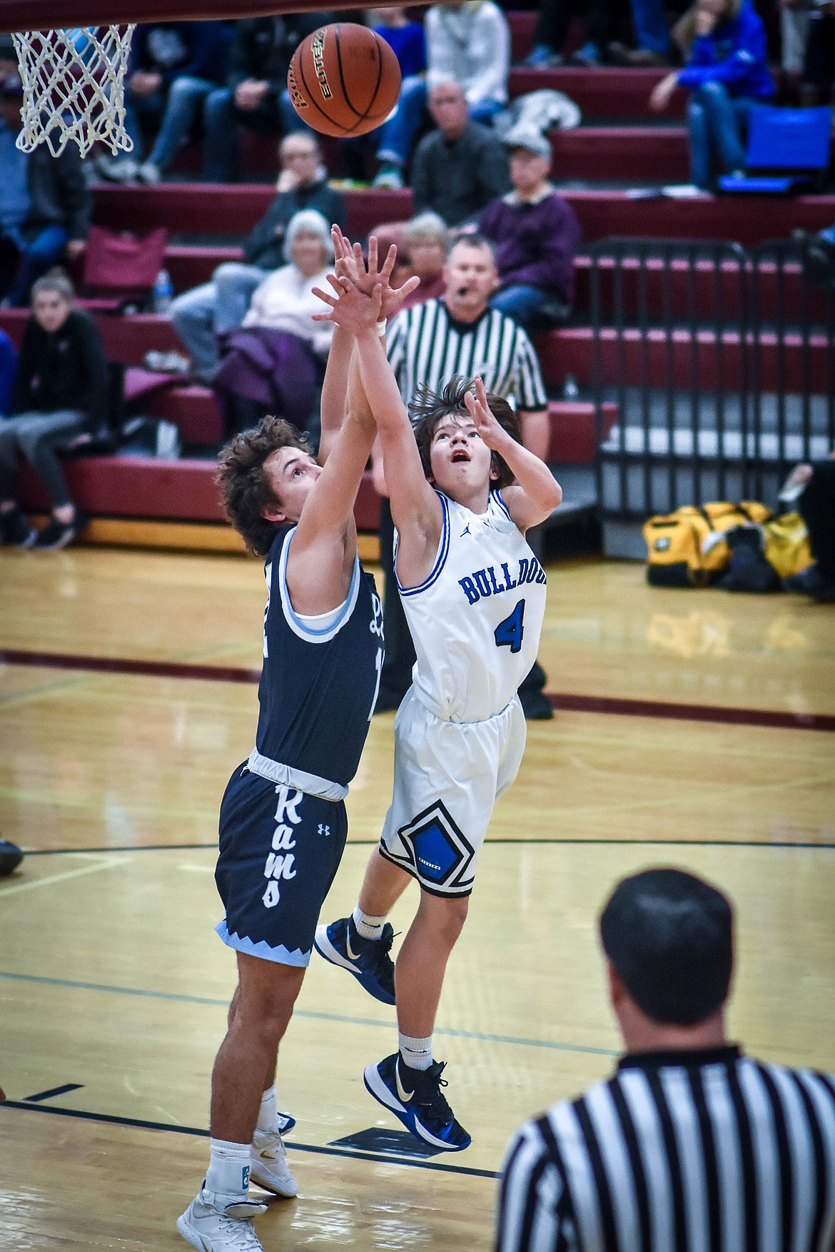 Zoran Lafrombo goes up against a player from Loyola-Sacred Heart in the opening round of the Western Divisional B Tournament in Hamilton last weekend. (Christa Umphrey photo)