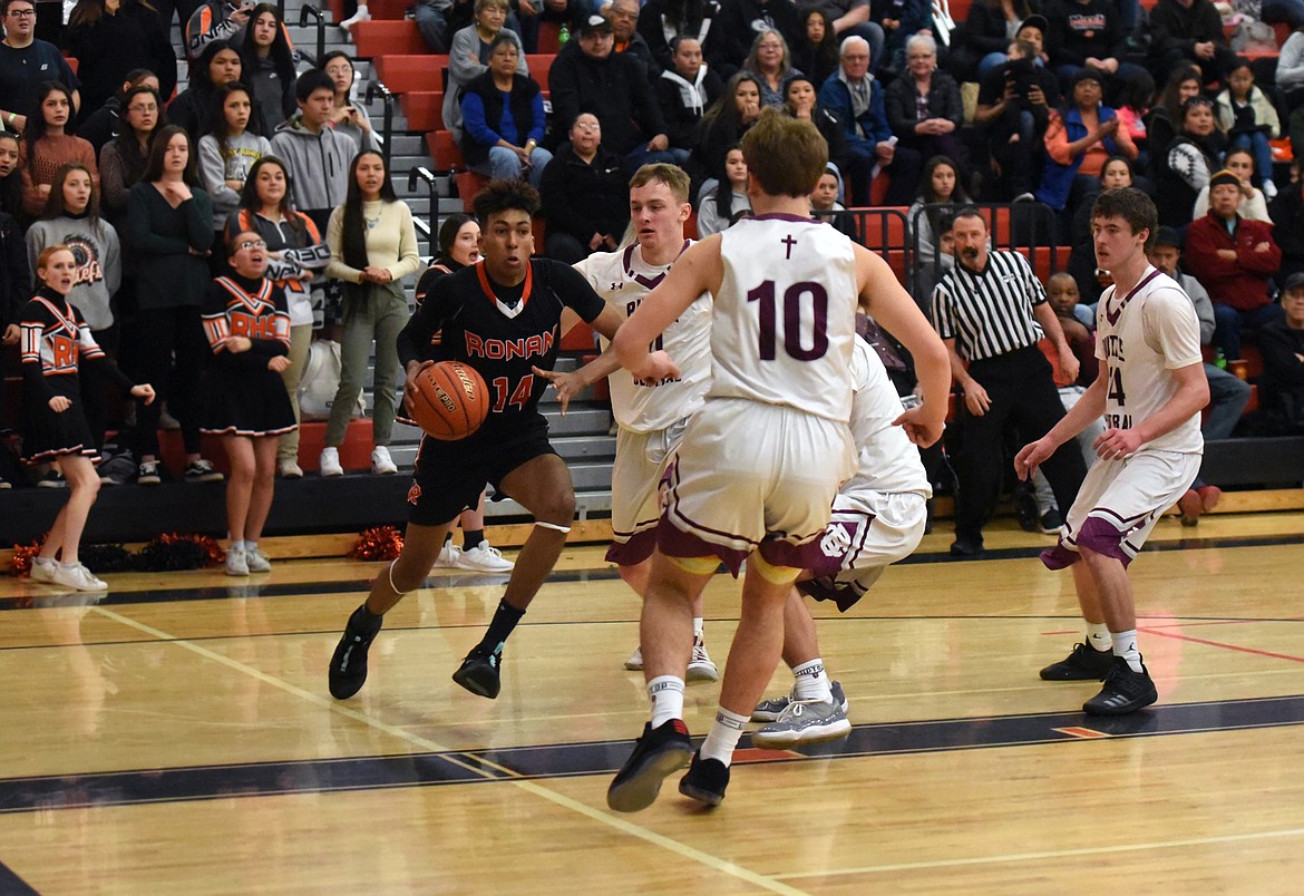 Ronan&#146;s Girma Detwiler drives along the baseline against Butte Central in the first round of the Western A Divisional Tournament Feb 27. (Whitney England/Lake County Leader)