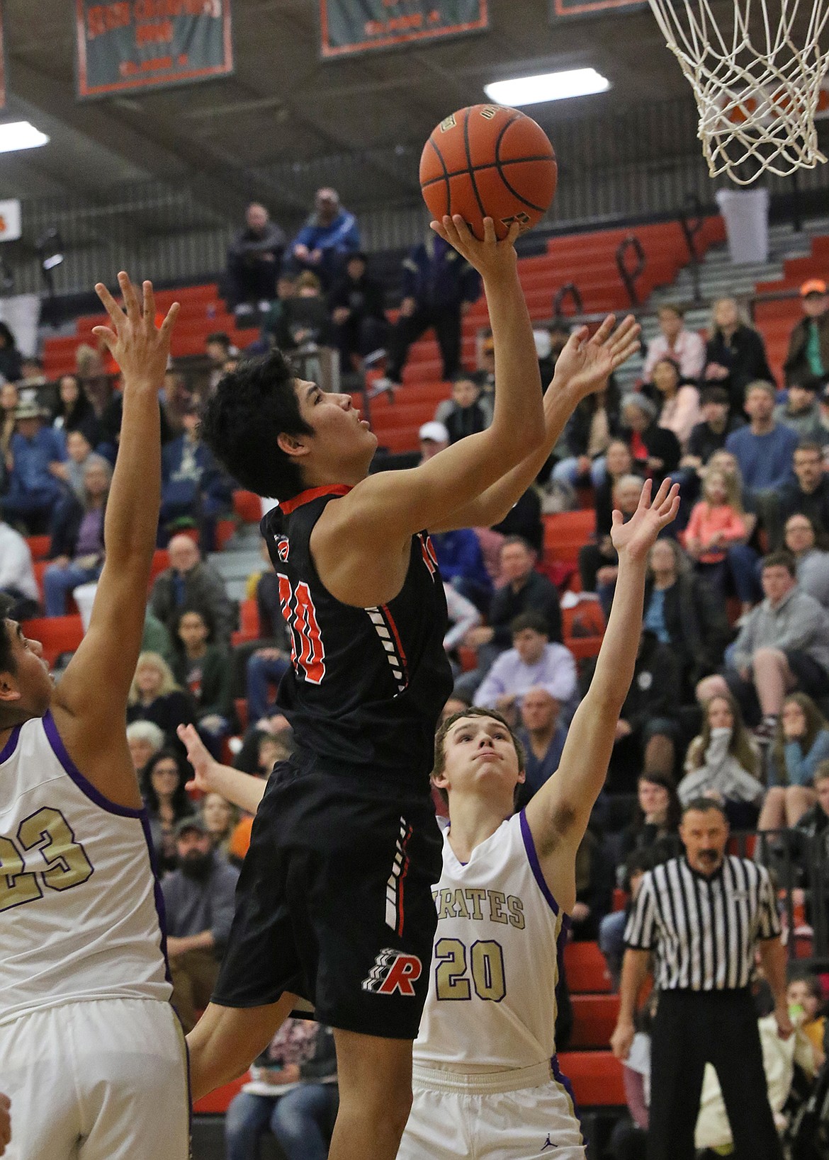 Ronan Chief Trey Don&#146;t Mix lays in two of his game high 17 points against Polson in loser-out action Friday afternoon at the Western A Divisional. (Bob Gunderson photo)