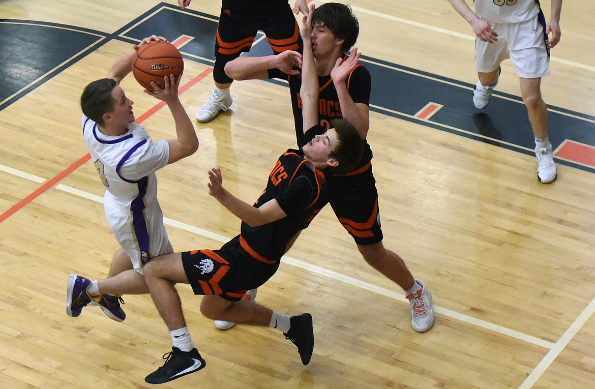 Pirate guard Xavier Fisher pulls up for a jump shot in the first round of the Western A Divisional Tournament in Ronan Feb. 27. (Whitney England/Lake County Leader)