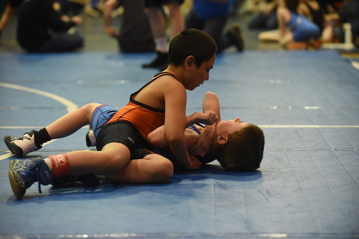 Ronan&#146;s Devin Aimsback wrestles Mission&#146;s Ray Evans at last Saturday&#146;s Little Guy Tournament in St. Ignatius. (Scott Shindledecker/Lake County Leader)