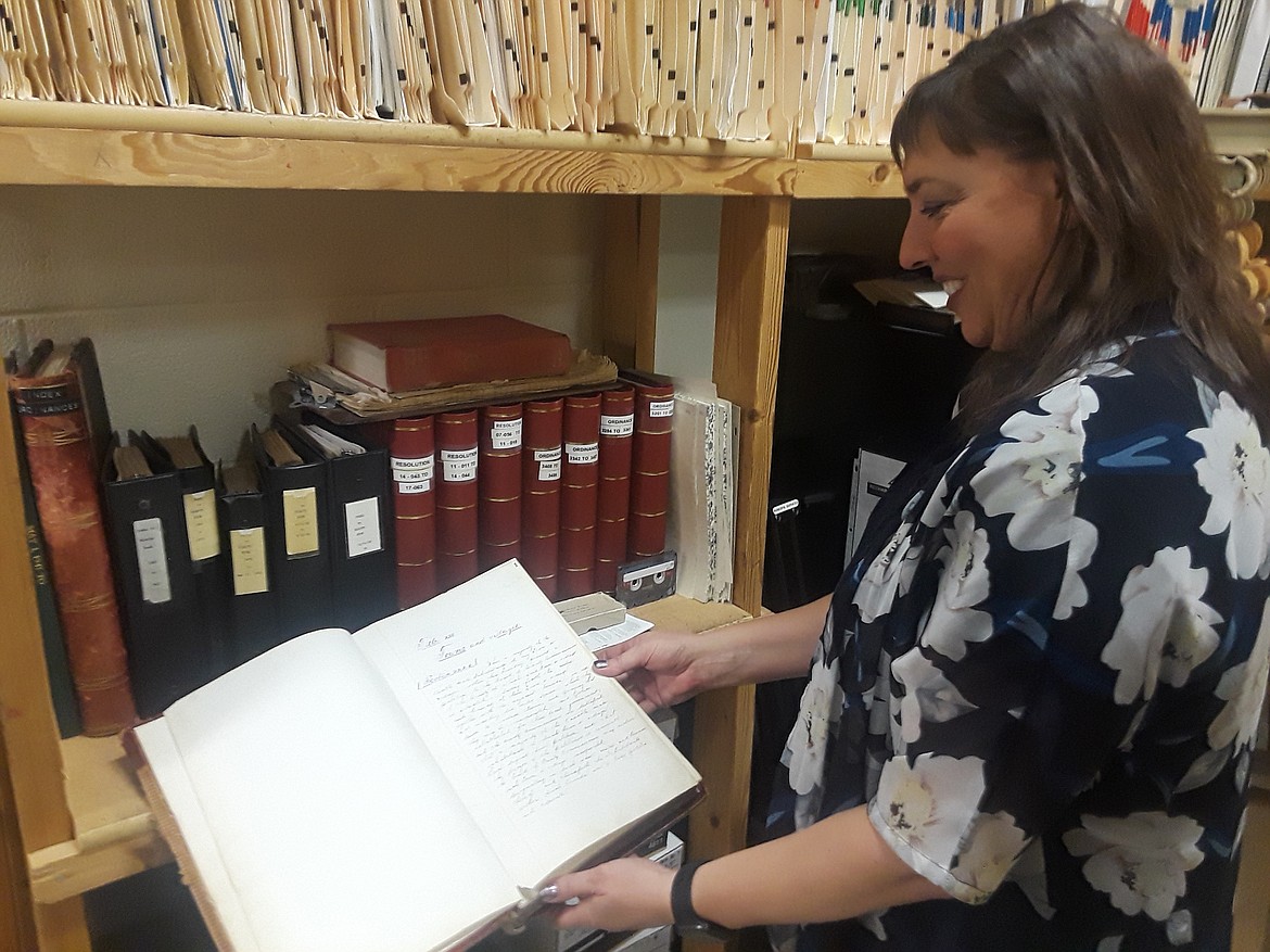 CRAIG NORTHRUP/Press
City Clerk Renata McLeod said each volume of archived minutes from Coeur d&#146;Alene&#146;s early years gives a glimpse into how our ancestors toiled to build a city from scratch.