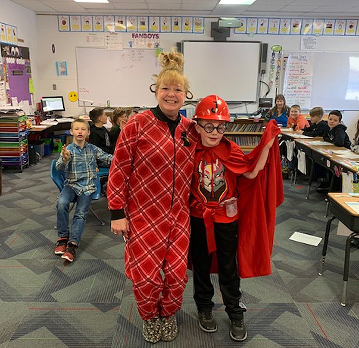 Mrs. Shaw and Jason Guill definitely had a good time at Dr. Seuss day at Noxon School last Friday.