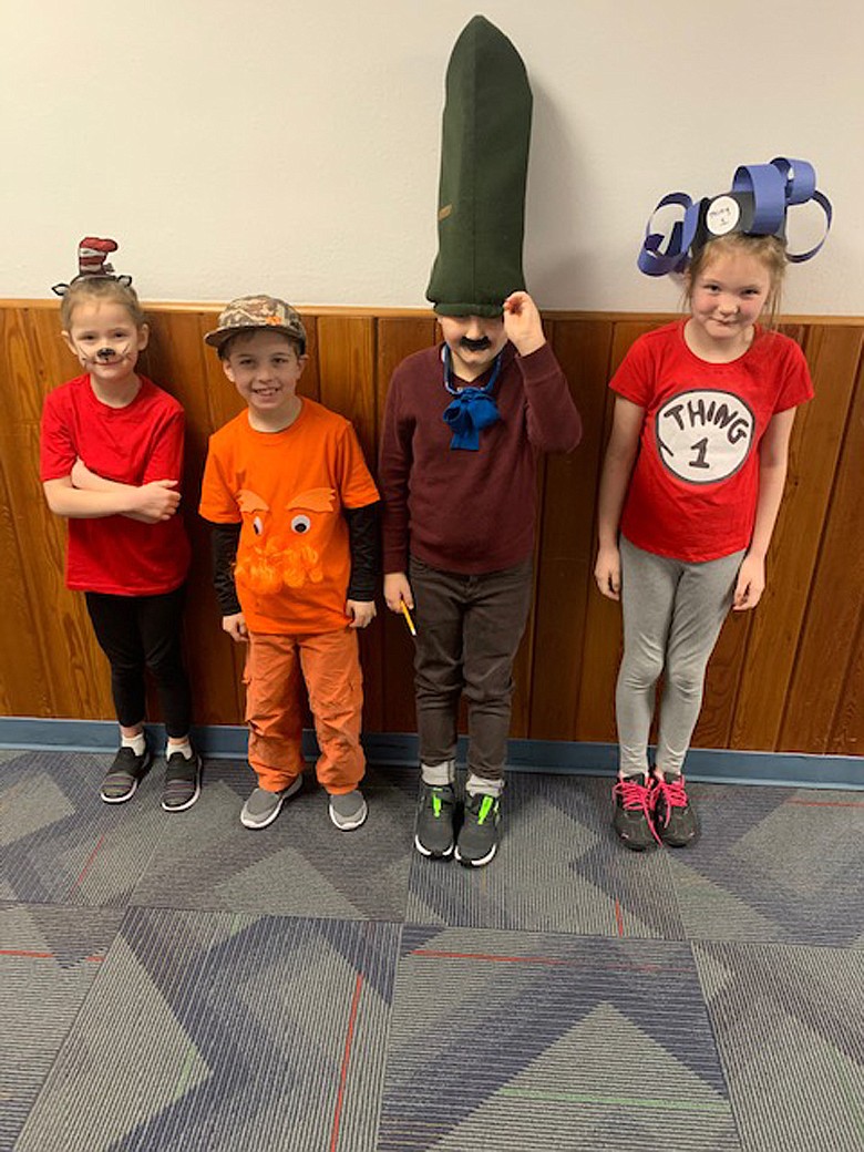 Dani Hill, Riley Sather, Asher Hartman and Maddie Thompson stopped for a photo last Friday during Noxon School&#146;s Dr. Seuss day.
