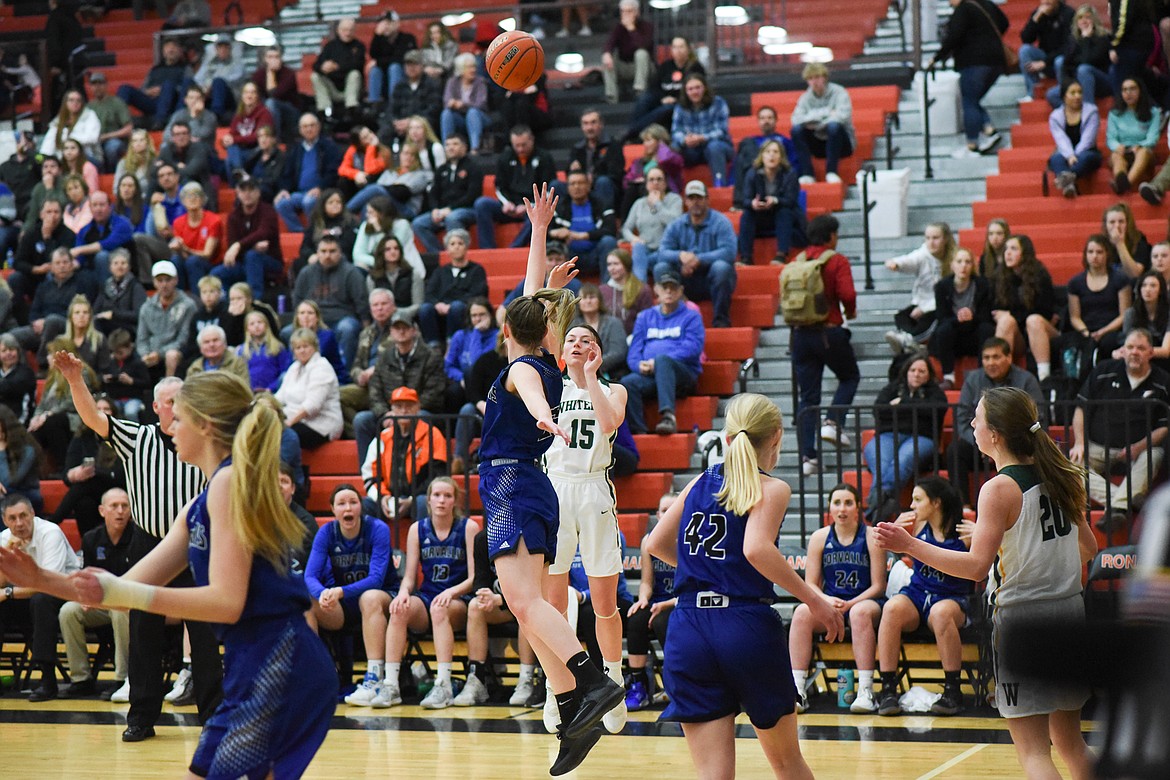 Payton Kastella launches a three during Friday's loss to Corvallis at the Western A Divisional Tournament in Ronan. (Daniel McKay/Whitefish Pilot)