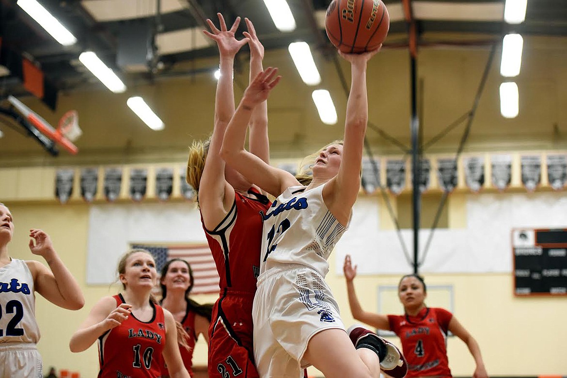 Clark Fork&#146;s Emmah Baughman goes in for a tough shot against West Yellowstone Friday at the Western C Divisional tournament in Frenchtown. (Jeremy Weber/Mineral Independent)