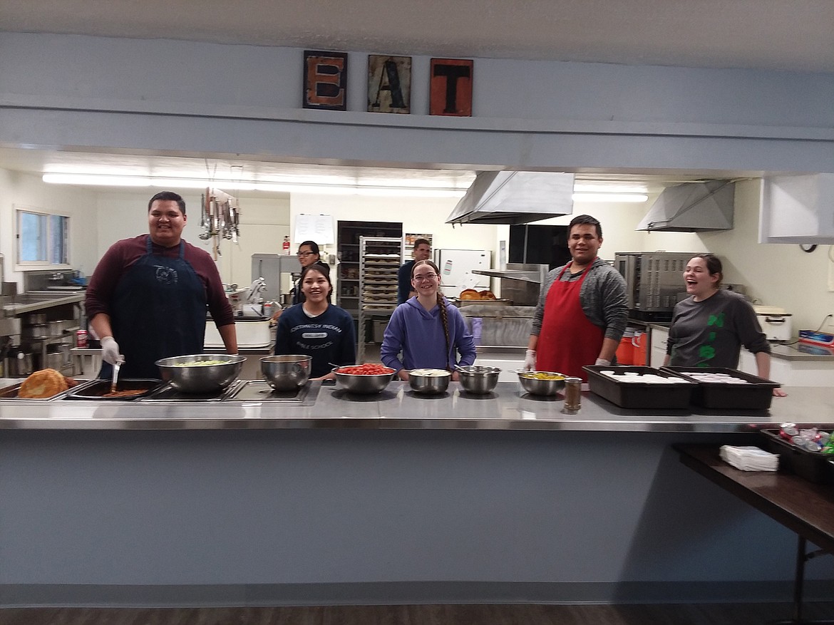 Members of the Northwest Indian Bible School senior class are ready to make Indian tacos recently. Their profit for this day was more than $600 which will go toward their spring break trip to Seattle. The next Indian Taco sale is March 16. (Monte Turner/Mineral Independent)