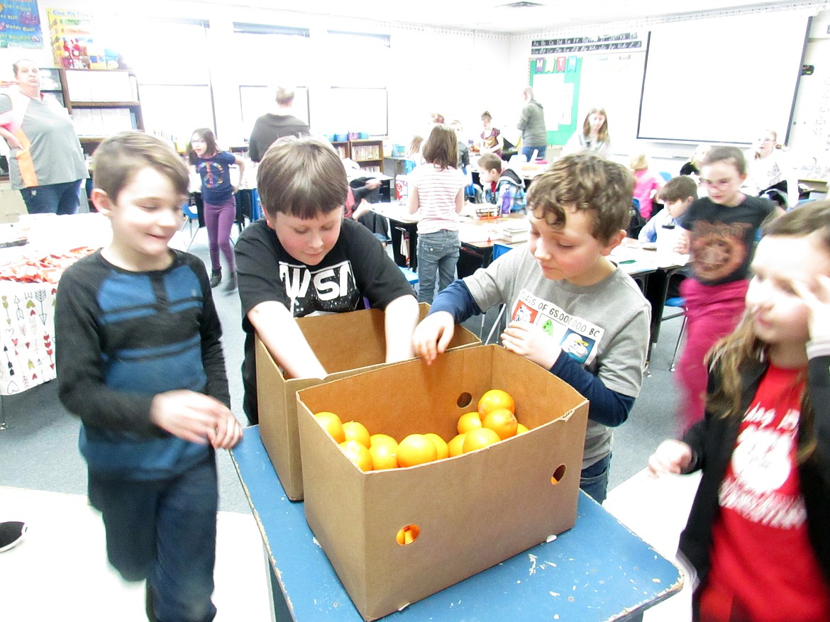 Idaho Hill Elementary students enjoy a snack of oranges thanks to a donation of several boxes of the fruit by one of the school&#146;s child sponsors. The individual recently donated several boxes of fresh oranges from Arizona where he winters. &#147;The kids and staff all enjoyed several of the delicious oranges,&#148; said the school&#146;s Dona Storro.

(Photo courtesy IDAHO HILL ELEMENTARY)