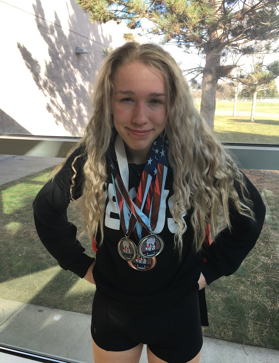 (Photo courtesy of CHRISTINA BALCH)
Sandpoint High School sophomore Kayelin Johansen poses for a photo after grabbing silver medals in freestyle and Greco-Roman and bronze in folkstyle while competing for the Lady Gladiators at the Columbia Cup on Saturday. Sandpoint&#146;s Kalila Tuinstra also competed.