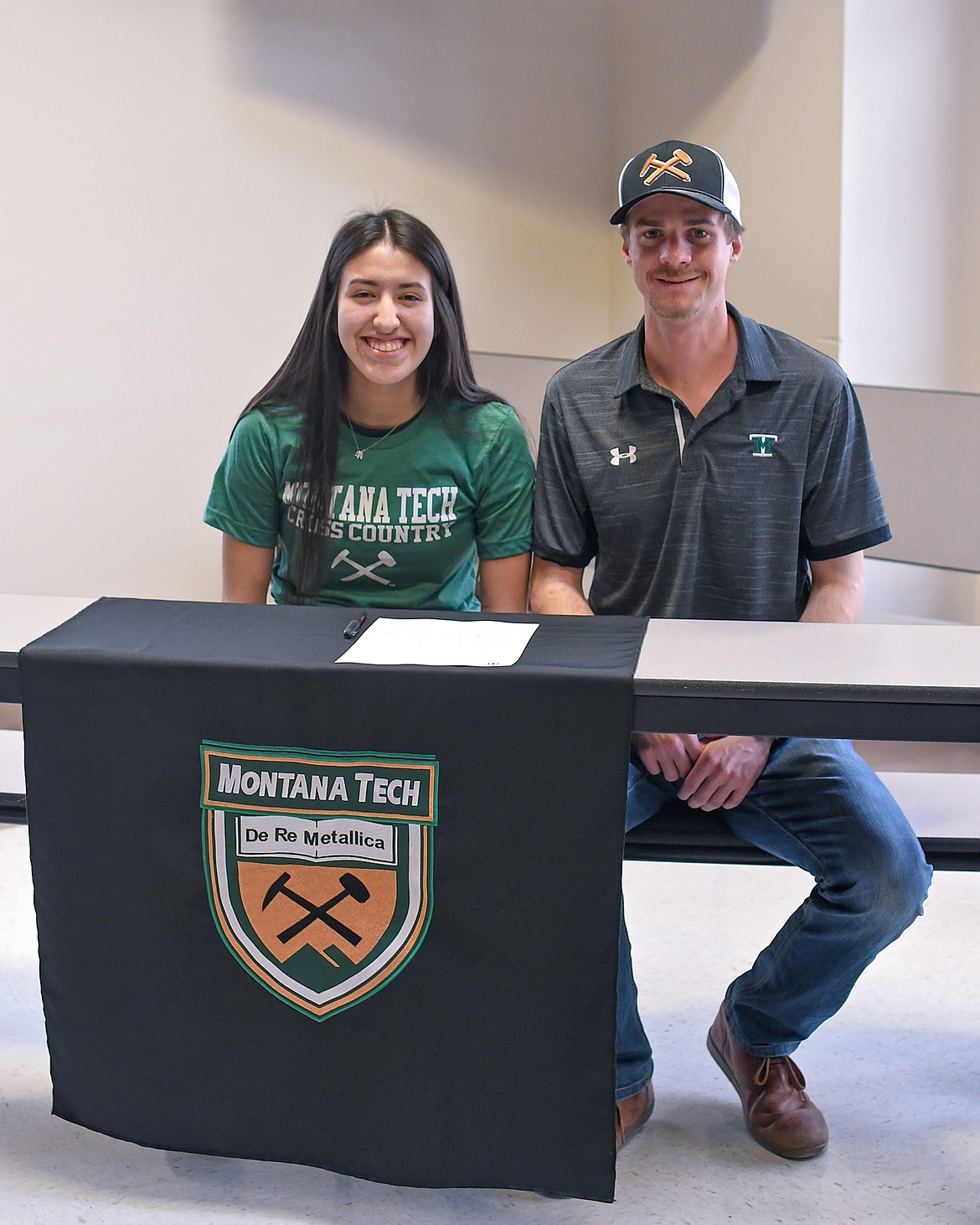 Mission senior Karolyna Buck with Montana Tech cross-country coach Zach Kughn. Buck signed a letter of intent to run cross-country at Montana Tech starting fall 2020. (Christa Umphrey photo)