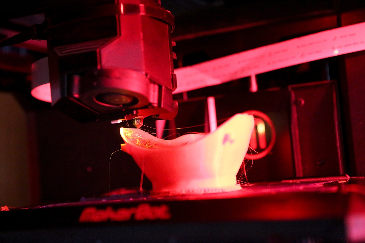 A 3D printer produces an N95 mask inside Todd Spangler&#146;s garage on Thursday in Kalispell. 
(Mackenzie Reiss/Daily Inter Lake)