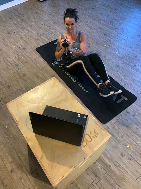 Photo courtesy of MONICA MILLER
Prospect Fitness Studio owner Monica Miller demonstrates how she will digitally interact with her students and post classes online.