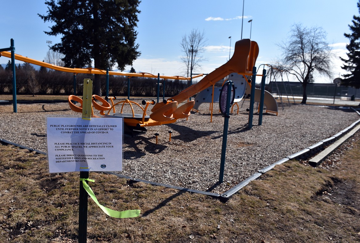 A sign at Memorial Park, lets visitors know that the playground is closed. The city closed public playgrounds until further notice in an effort to slow the spread of the coronavirus. Parks and open spaces still remain open. (Heidi desch/Whitefish Pilot)