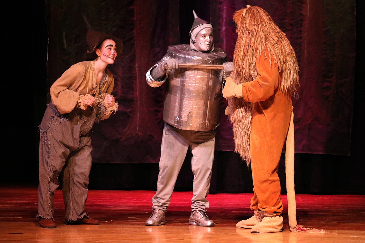 The Scarecrow (April West), Tinman (Gabriel Falzarano) and Cowardly Lion (Jaydon Toftum) discuss ways to save Dorothy during Columbia Falls High School&#146;s recent production of &#147;The Wizard of Oz.&#148; (Kate Daniels photo)