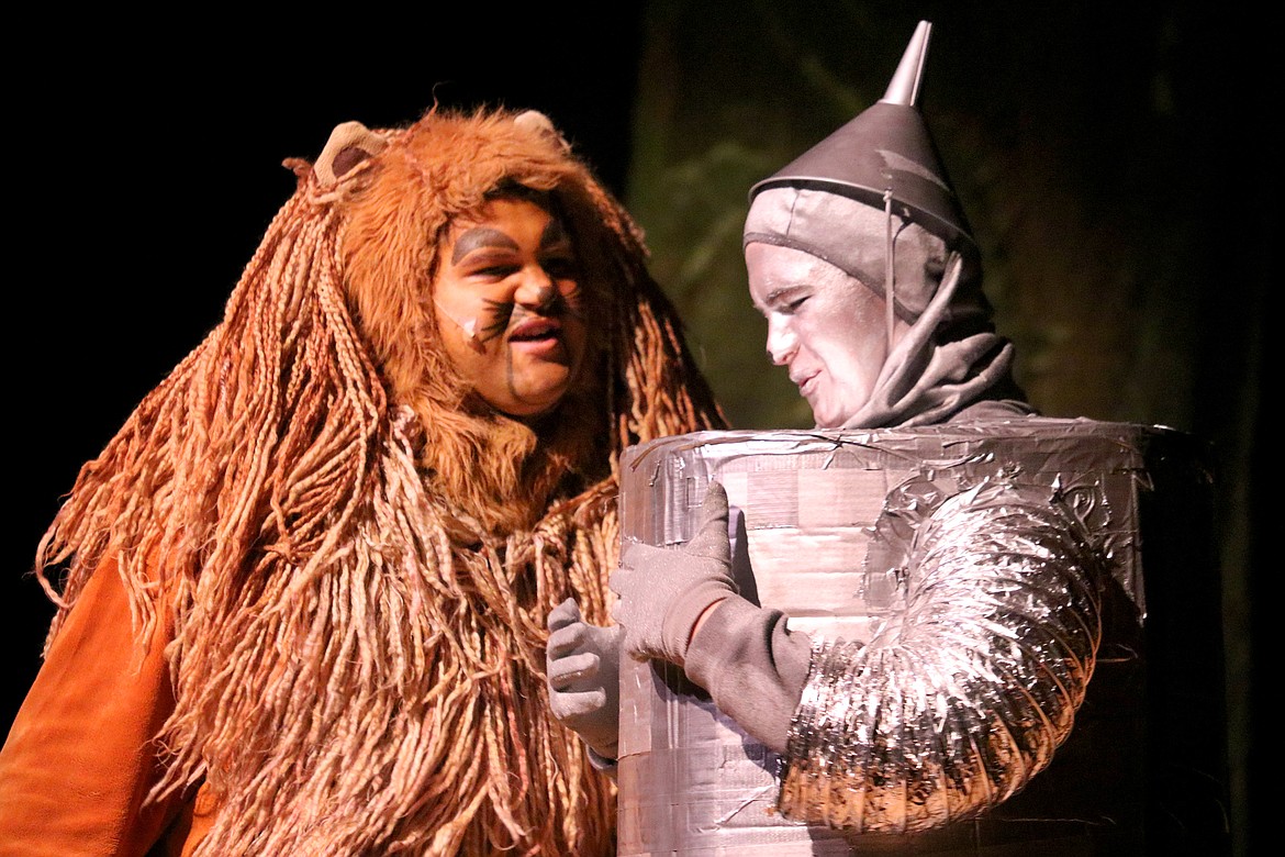 Cowardly Lion (Jaydon Toftum) and Tinman (Gabriel Falzarano) share the stage.
