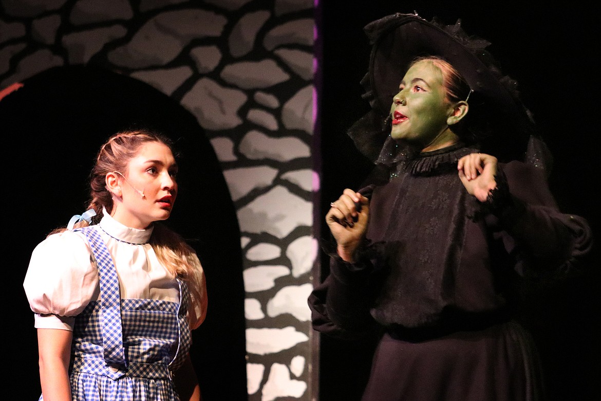 The Wicked Witch of the West (Katie Triplett) explains her villainous plans for Dorothy (Noel Royer). (Kate Daniels photo)
