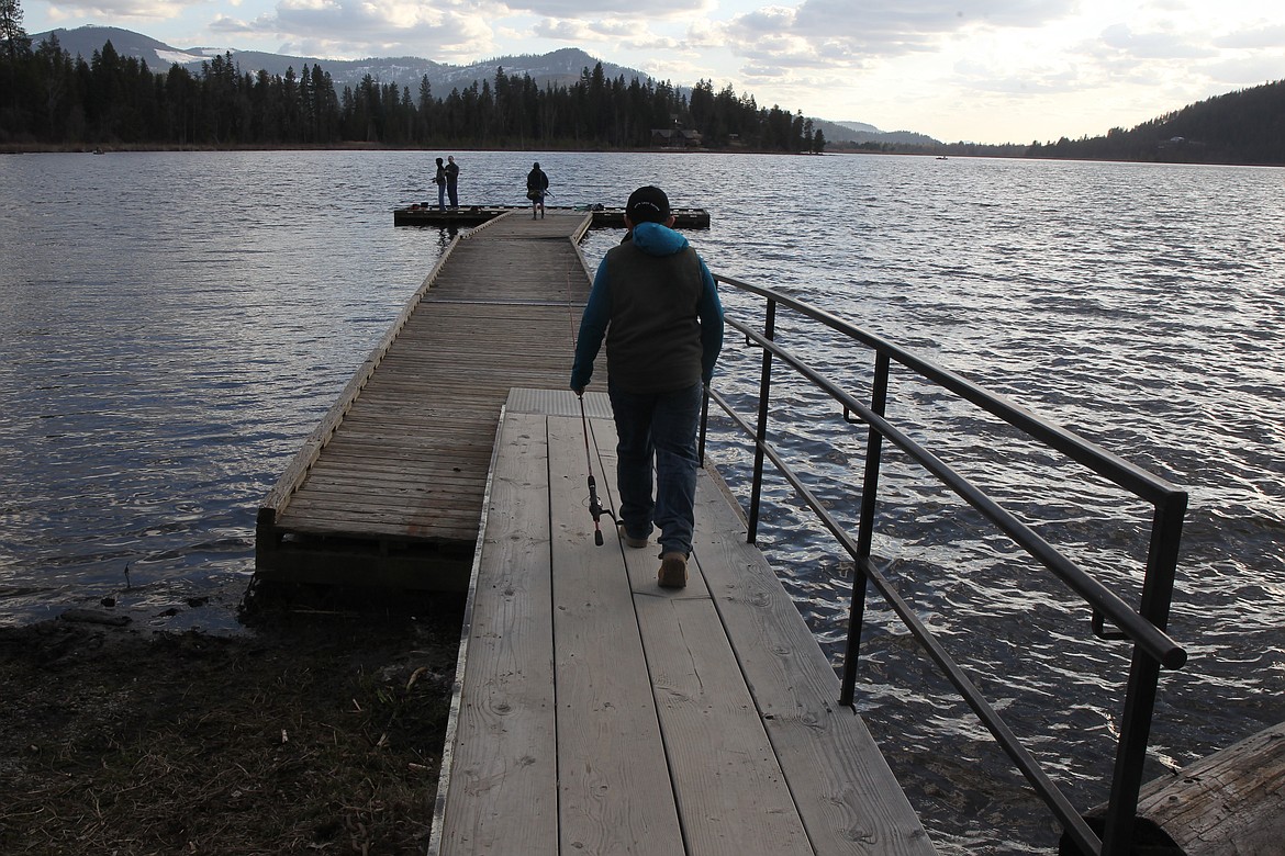 BILL BULEY/Press
A youth heads out to fish at Rose Lake.