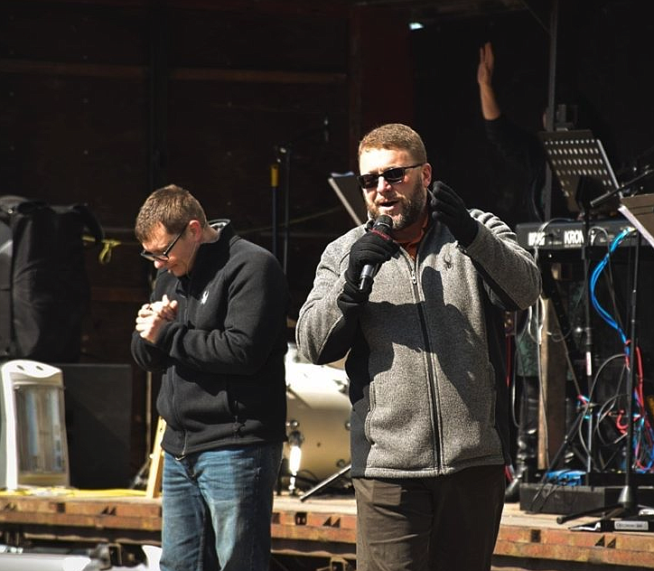 Photo by WORSHIP CENTER
Worship Center pastor Corey Berti prays while Cornerstone Church Pastor Cody Karst bows his head in the background.