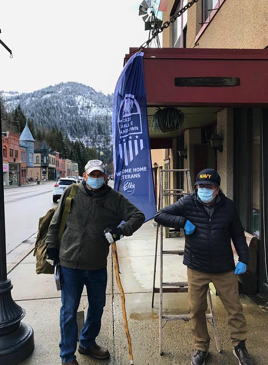 Photo by SHARON HOWARD 
Wallace Elks Veteran&#146;s Committee members Clyde Horning and Tommy Hayes hand out grab-bags to veterans in Wallace last Thursday.