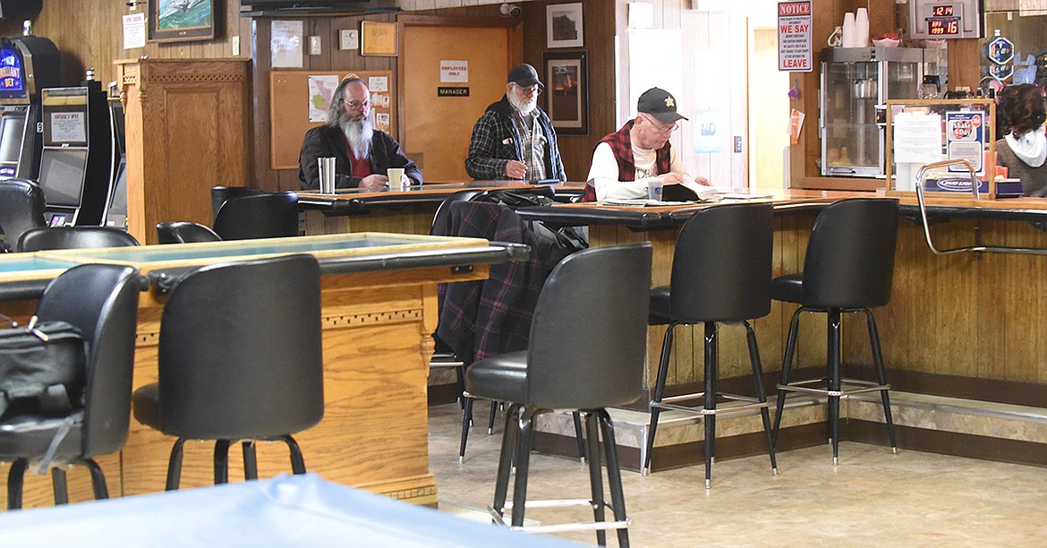 Plains VFW Post 3596 officers, including club manager Gary Jenson, center, work on plans for the re-opening. It closed March 27 due to an order by Gov. Steve Bullock due to the COVID-19 pandemic. (Scott Shindledecker/Valley Press)