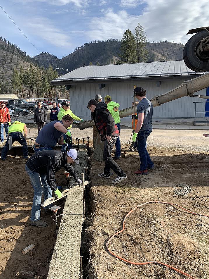 Volunteers prepare to pour concrete in the footers for the new jump pits at Superior School. 
(Courtesy photo)