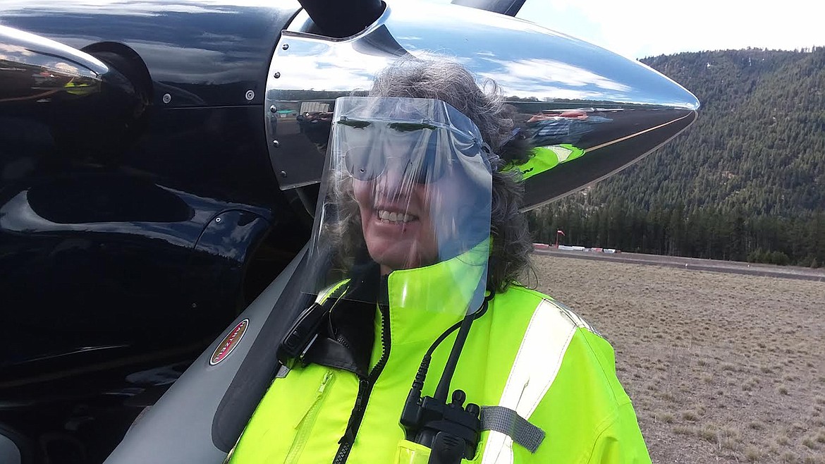 West End  Volunteer Fire Department&#146;s  Donna Richter models a face shield delivered by Bridger Aerospace last week. The COVID-19 pandemic created a nationwide shortage, including for first responders. Bridger made and donated thousands of masks to rural departments across Montana. (Monte Turner/Mineral Independent)