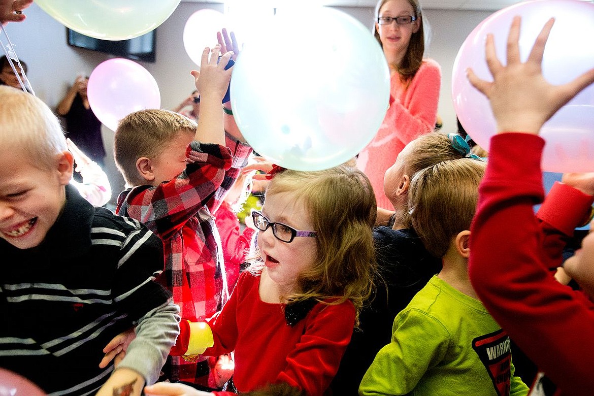 &lt;p&gt;At center, Colette Collins, 3, of Coeur d'Alene, parties with other kids her age as they celebrate New Year's at noon at the Noon Year's Eve event Thursday at the Hayden Public Library.&lt;/p&gt;