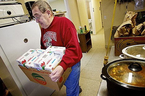 &lt;p&gt;Howard Martinson, the executive director for Fresh Start, carries in a box of donated cereal Monday.&lt;/p&gt;