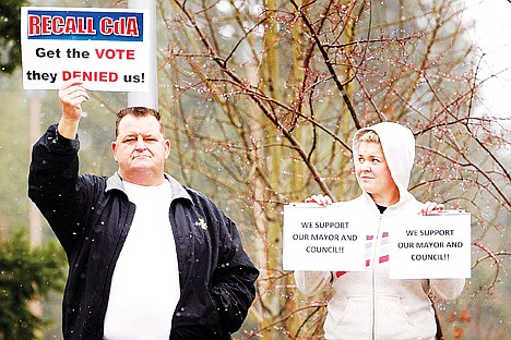 &lt;p&gt;Jennifer Drake glances over at Michael Sheneman as they stand next to each other April 4, 2012, at a Recall CdA rally as the two display opposite opinions of movement to recall the Coeur d'Alene mayor and half the city council.&lt;/p&gt;