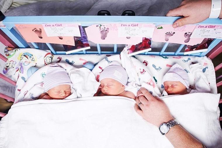 &lt;p&gt;Patrick Cote/Daily Inter Lake New-born triplet Kara Cook grabs the finger of her father Graham on Friday afternoon at Kalispell Regional Medical Center. Friday, Dec. 28, 2012 in Kalispell, Montana.&lt;/p&gt;