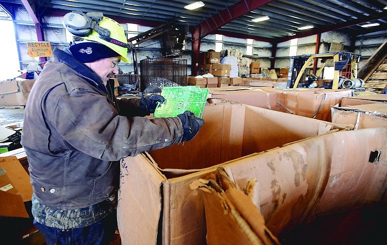 &lt;p&gt;Recycling supervisor Randy Augusta sorts through a box containing various electronic parts on Wednesday at Pacific Steel and Recycling in Evergreen.&lt;/p&gt;