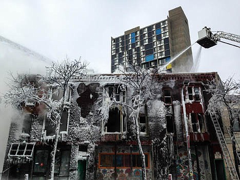 &lt;p&gt;Firefighters work the scene where a fire engulfed several apartment units in the Cedar Riverside neighborhood, in Minneapolis, Wednesday. Authorities say at least 14 people have been hurt.&lt;/p&gt;